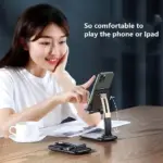 Foldable universal mobile stand holding a smartphone on a desk. - Obeepo.in